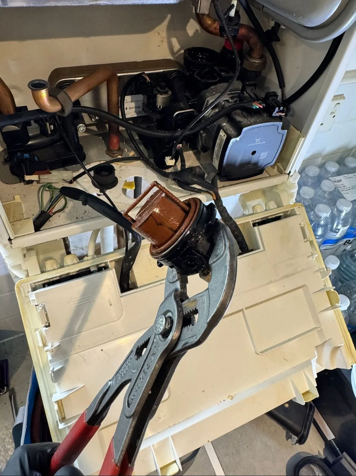 Internal boiler components laid out during a service